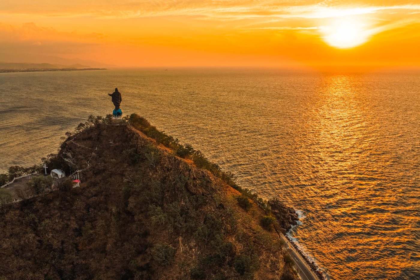 Cristo Rei statue above Dili bay at sunset